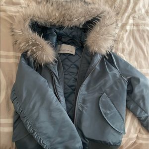 Baby blue bomber with white/gray fur hood